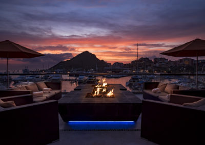 A fire pit sitting on top of a patio.