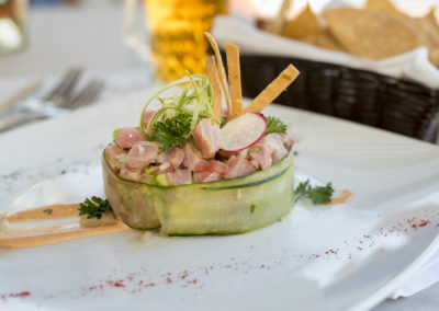 A small bowl of food on top of a table.